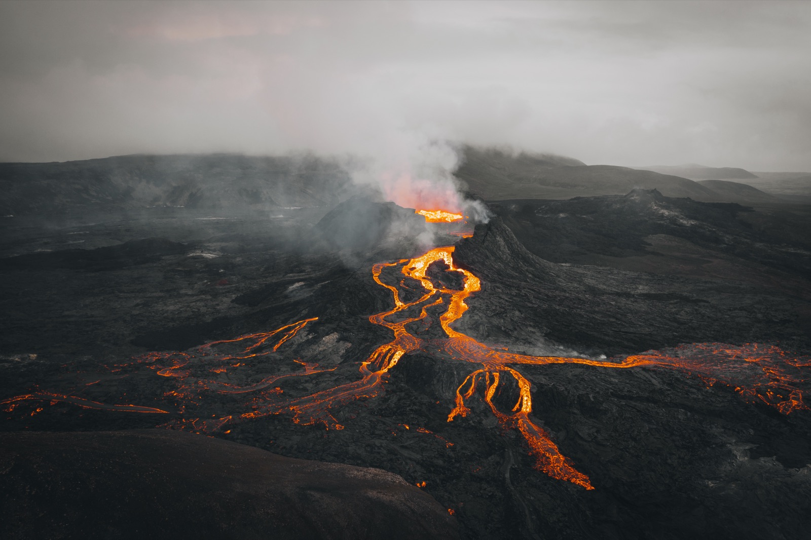 Aerial view of glowing lava streams and volcanic terrain at Fagradalsfjall on the Reykjanes Peninsula in Iceland