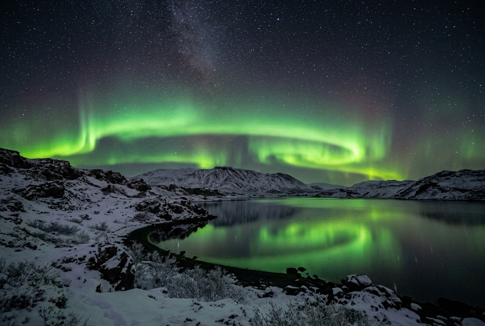Lake Mývatn volcanic landscape and aurora skies in North Iceland
