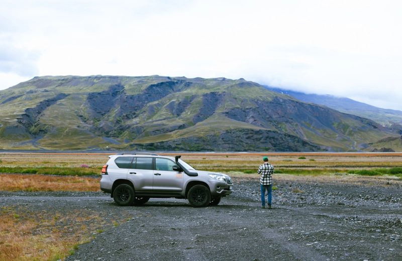 Go 4x4 Cruiser F-road campervan on open Highland gravel below an Icelandic mountain